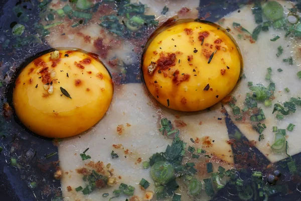 Consecutive steps of preparing fried eggs with ham and herbs — Stok fotoğraf