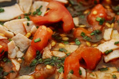 Consecutive steps of preparing scrambled eggs with tomatoes and 