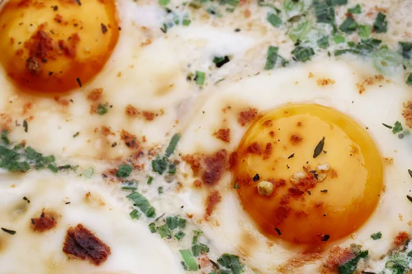 Consecutive steps of preparing fried eggs with ham and herbs — Stok fotoğraf