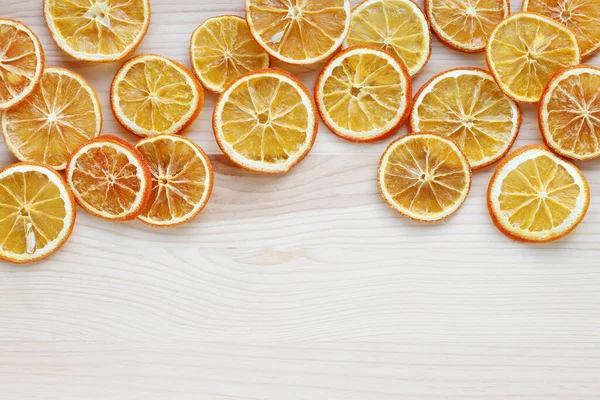 A sliced dry oranges on wooden table, Christmas decoration. — Stock Photo, Image