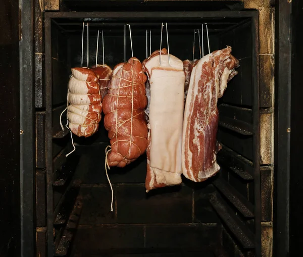 Cold cuts in the smokehouse. — Stock Photo, Image