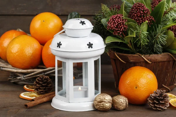 White Iron Lantern Candle Pile Oranges Floral Arrangement Skimmia Flowers — Stock Photo, Image