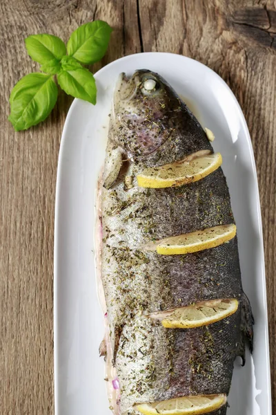 Baked rainbow trout with lemon. Dinner dish