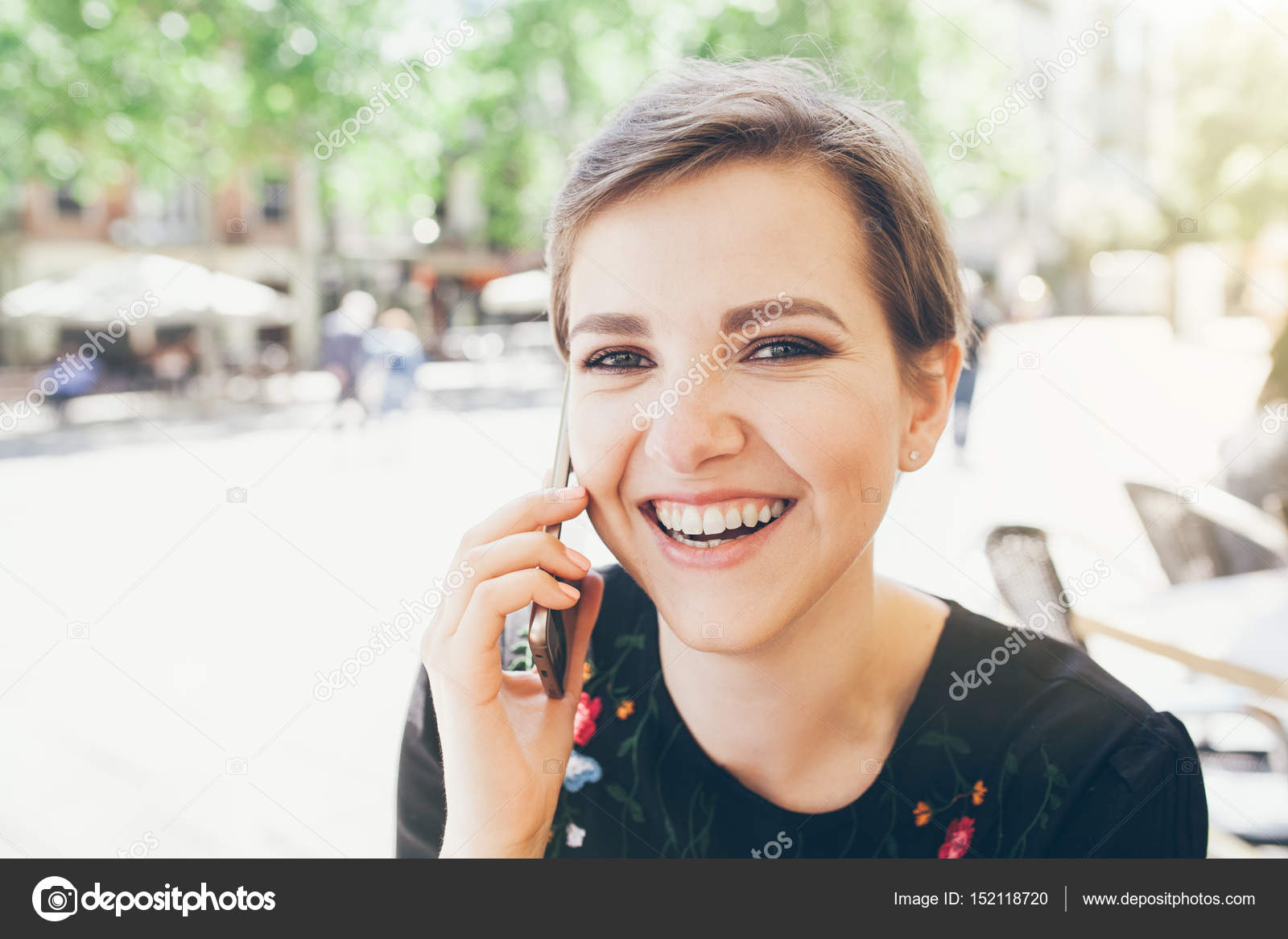 Girl With Short Pixie Haircut Is Having A Phone Conversation