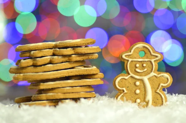 Delicious decorated Christmas cookies on bokeh background — Stock Photo, Image