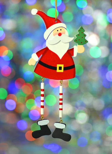 Christmas decoration, santa claus on colorful bokeh background — Stock Photo, Image