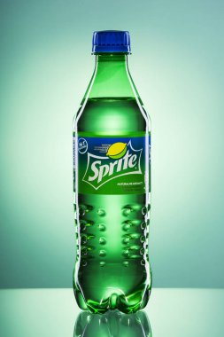 KWIDZYN, POLAND  APRIL 4, 2017: Bottle of Sprite drink on gradient background.  Sprite is lemon-like flavored soft drink produced by Coca-Cola Company. Sprite was introduced in 1961. clipart