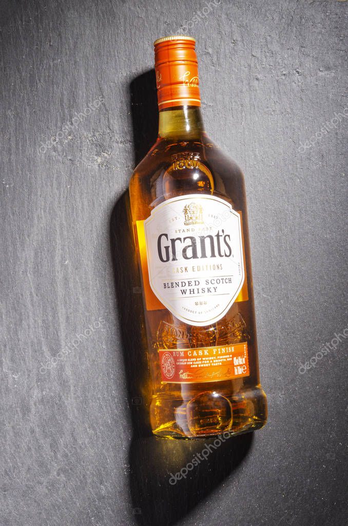 Grants rum cask finish whisky on stone slate background. Grants has been produced by William Grants and sons in Scotland since 1887