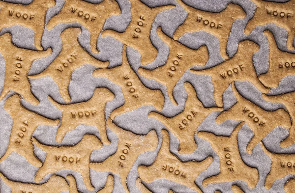 Making homemade dog treats in the shape of a bone. — Stock Photo, Image