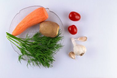 Vegetable vegetarian salad with fresh vegetables and baked potatoes in the oven.