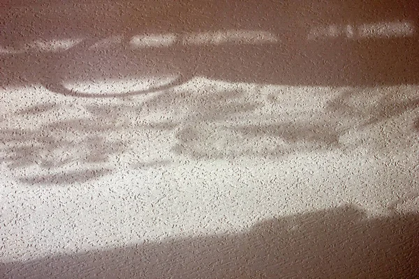 Drawing on the wall of the house in Sunny weather with the reflection of light and shadow.