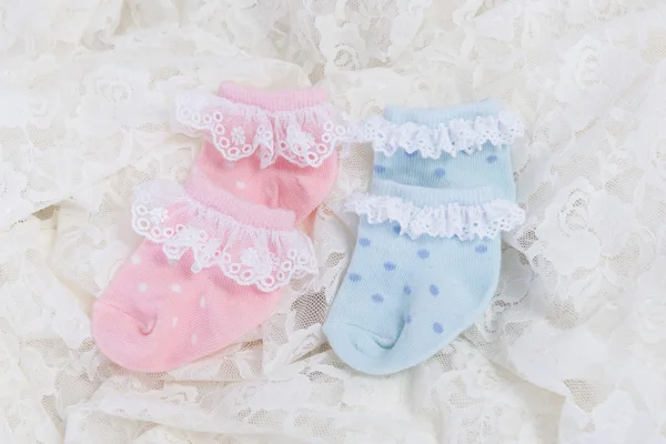 baby socks for new born baby on Wedding lace background