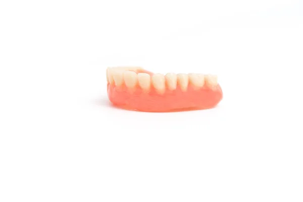 Upper dentures on white background — Stock Photo, Image