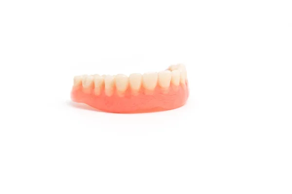 Prótesis dentales superiores sobre fondo blanco —  Fotos de Stock