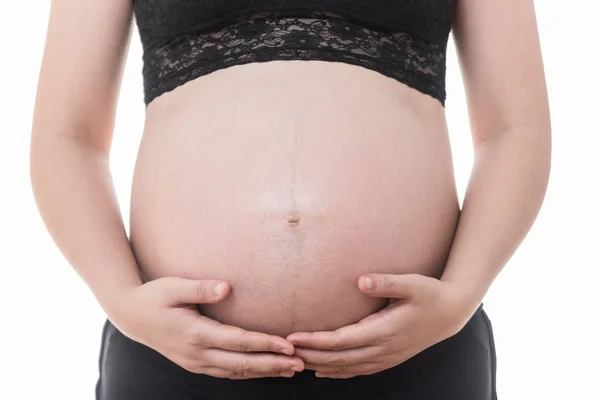 Close up image of pregnant woman  touching her belly with hands — Φωτογραφία Αρχείου
