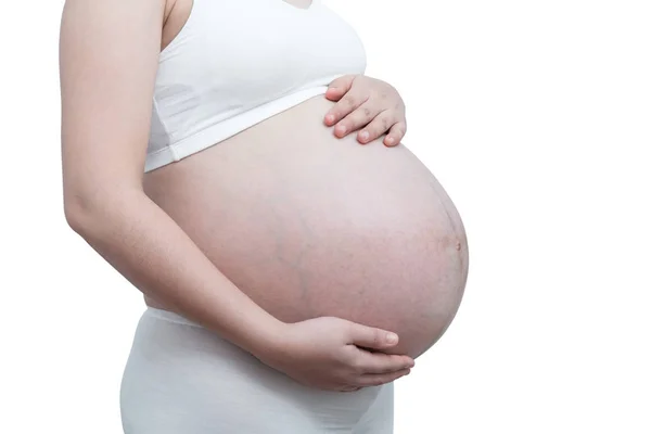 Η κοιλιά asia έγκυος γυναίκα κρατώντας την κοιλιά της απομονώνονται σε λευκό φόντο — Φωτογραφία Αρχείου
