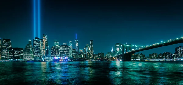 Manhattan skyline at night seen from Brooklyn. Tribute in Light