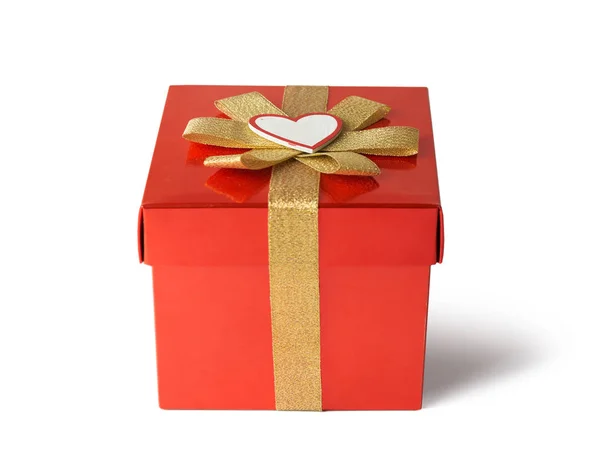 Gift for Valentine's Day, wrapped in red wrapping paper with gold — Stock Photo, Image