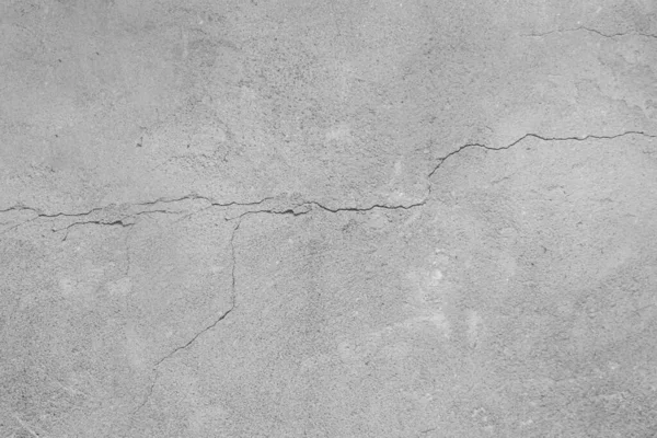 Gray concrete background with cracks