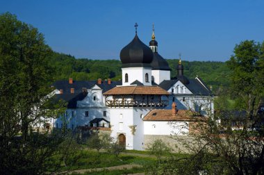 View to the old monastery on sunny day clipart