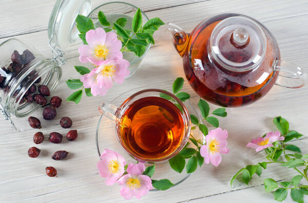 Teapot and cup of rose hip tea