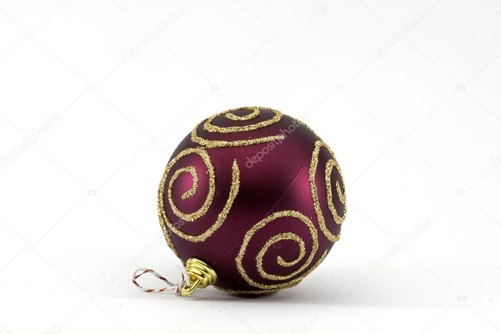 Dark red Christmas ball with gold stripes isolated on white background