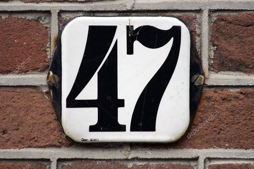 Square metal house number forty seven