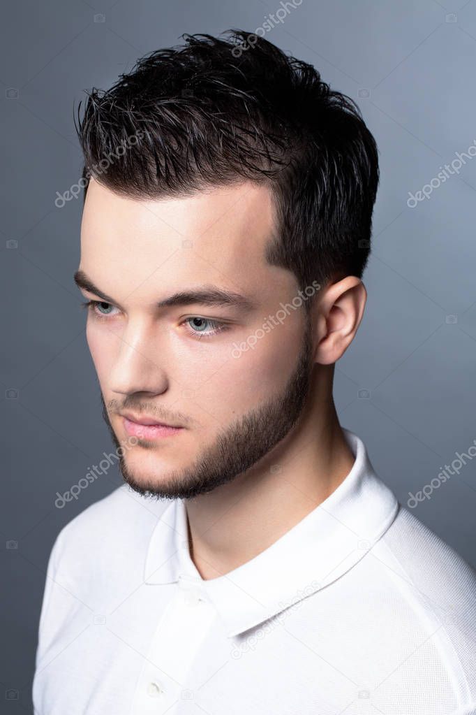 Handsome young fashion model man portrait. Attractive Guy face c