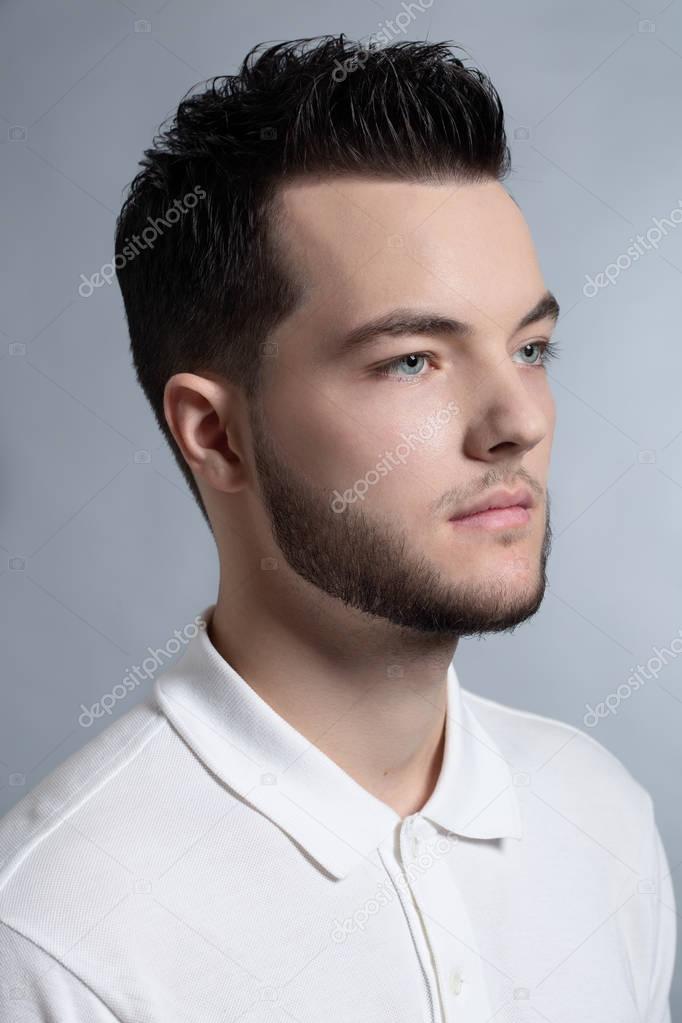 Handsome young fashion model man portrait. Attractive Guy face c