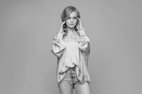 Black and white fashion portrait of a  young woman with a bright