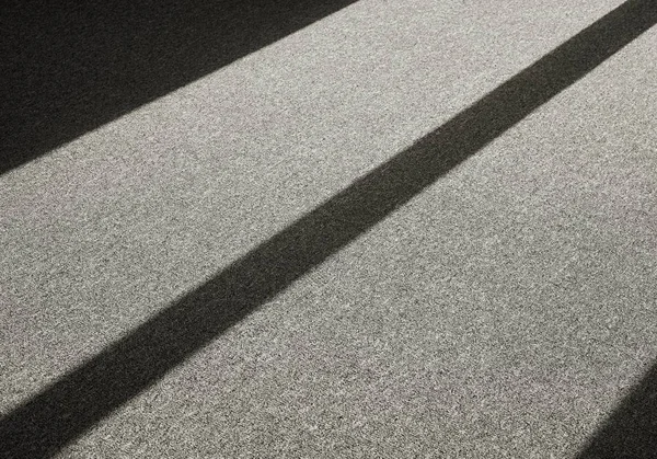 Тінь на підлозі килима — стокове фото