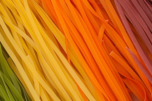 Wheat motley noodles background — Stock Photo, Image