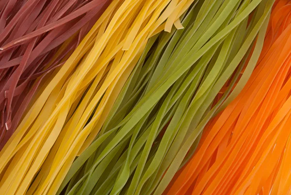 Wheat motley noodles background — Stock Photo, Image