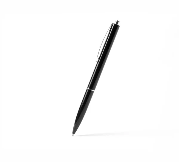 Black plastic ballpoint pen on a white background. — Stock Photo, Image