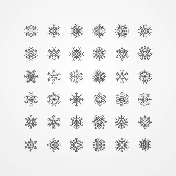 Coleção de flocos de neve pretos em um fundo branco — Vetor de Stock