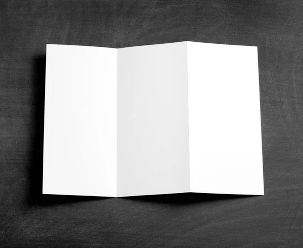 Blank folding page booklet on a black chalkboard. — Stock Photo, Image