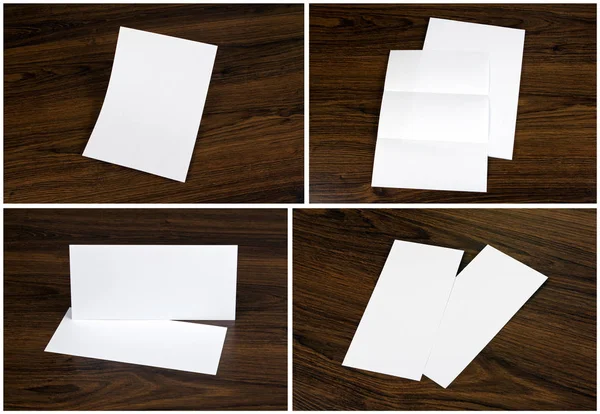 Σύνολο κενό λευκό φυλλάδια πέρα από το ξύλινο υπόβαθρο — Φωτογραφία Αρχείου