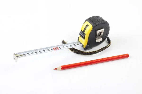 Black tape-measure with red pencil on a white background. — Stock Photo, Image