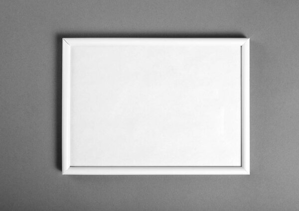 White wooden frame for painting or picture on grey background