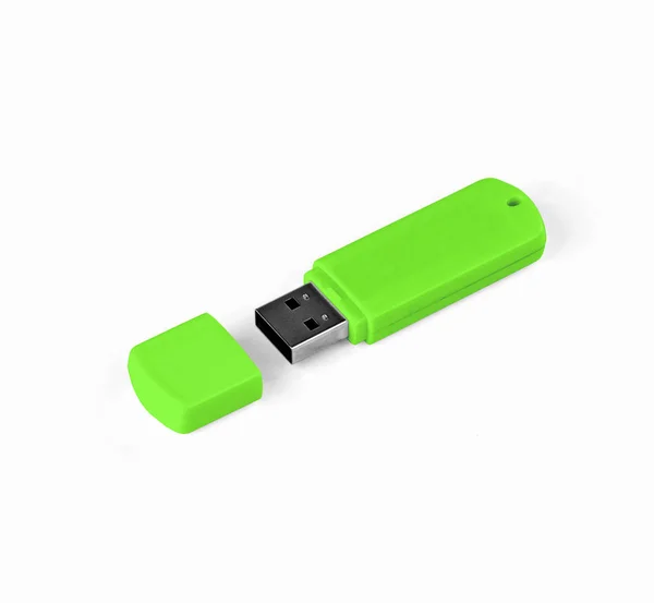 Unidad flash USB verde sobre un fondo blanco . — Foto de Stock