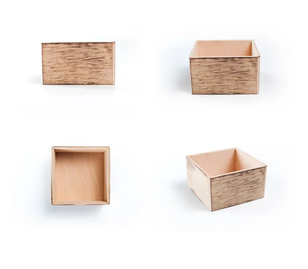 Diverso punto di vista di scatole di legno su sfondo bianco . — Foto Stock
