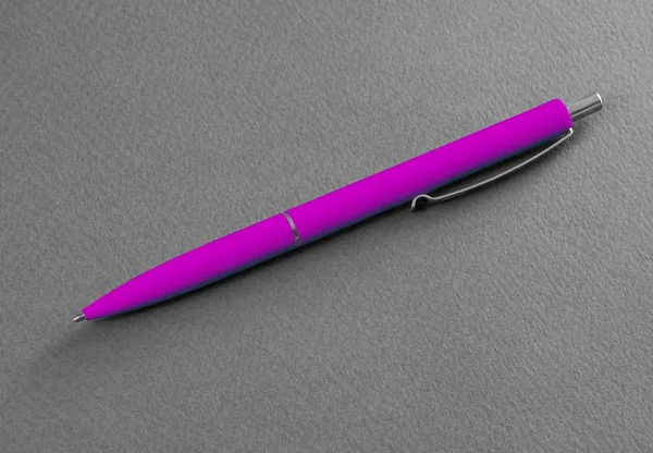 Pink pen on a gray background. — Stock Photo, Image