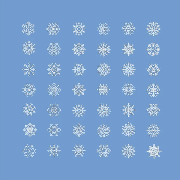 Icono de copos de nieve blancos sobre fondo azul — Vector de stock