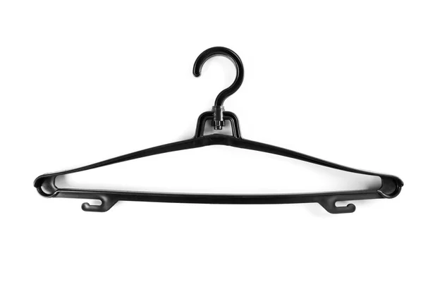 Black plastic hanger for clothes on a white background. — Stock Photo, Image