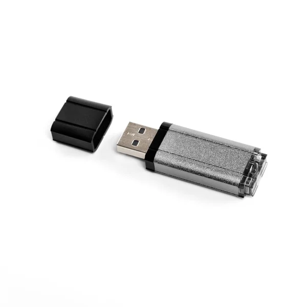 Cinza usb flash drive em um fundo branco . — Fotografia de Stock