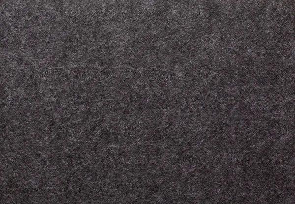 Tło tkanin z ciemnego materiału włókienniczego przydatne jako tło. — Zdjęcie stockowe