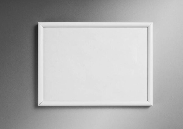 White frame for paintings or photographs on gray background