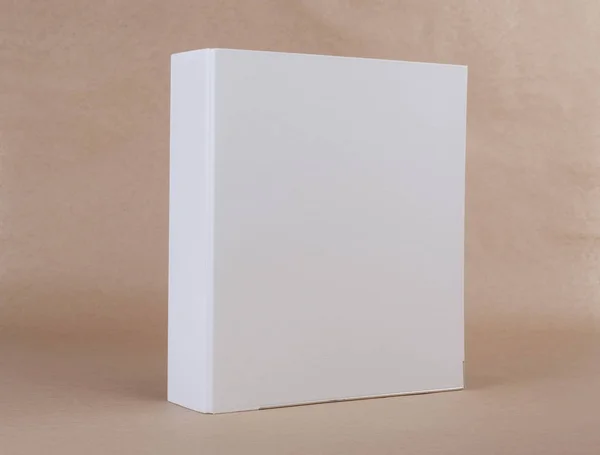 A white ring binder on beige background. — Stock Photo, Image