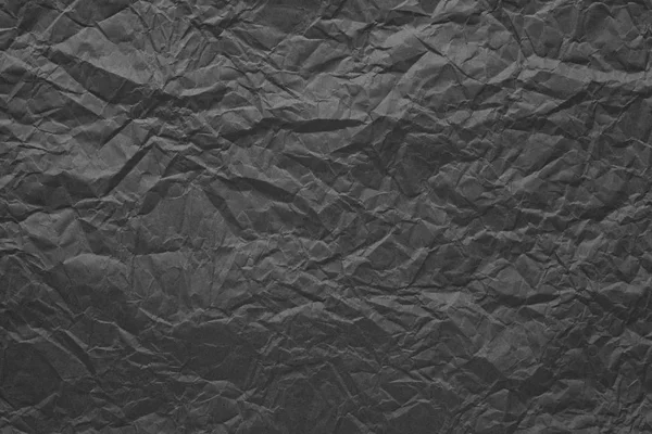 Graues zerknülltes Packpapier. abstrakter Hintergrund für Design. — Stockfoto