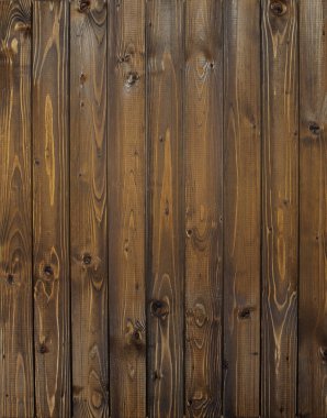 Ahşap duvar dikey plakalar ile. Eski bir ahşap çit panelleri yakın çekim.